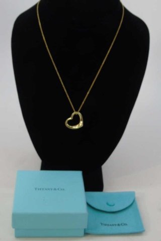Tiffany & Co 18kt Yellow Gold Elsa Peretti Heart: Tiffany & Co 18kt Yellow Gold Elsa Peretti Heart Necklace. Original box and dustcover. Hallmarked and signed. Chain measures 16 inches in length. Weighs approximately 6.2 grams.