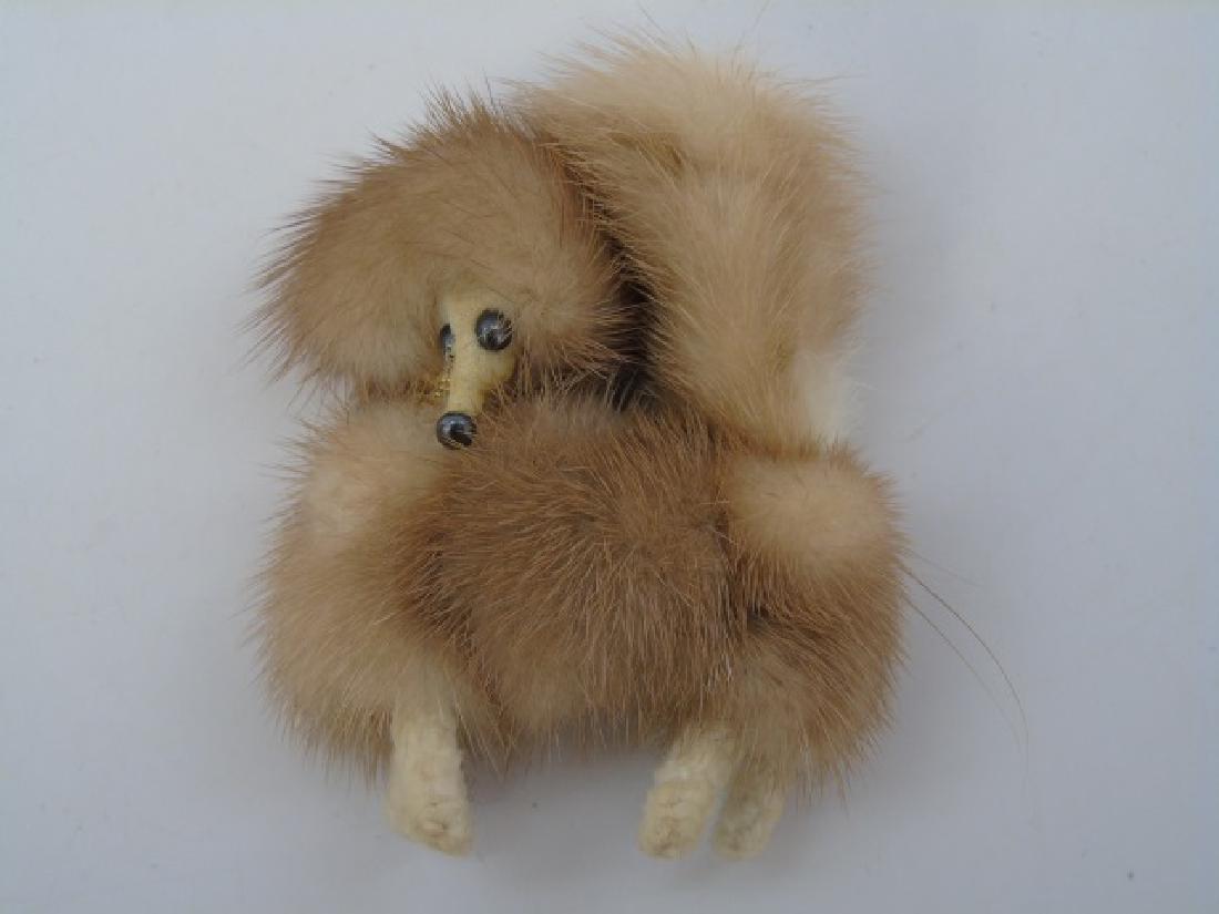 Vintage Genuine Mink Dog Pin / Brooch: Genuine Mink Dog Pin/Brooch. Dog has black beaded eyes with a gold tone collar. Measures 2.5 inches in height.