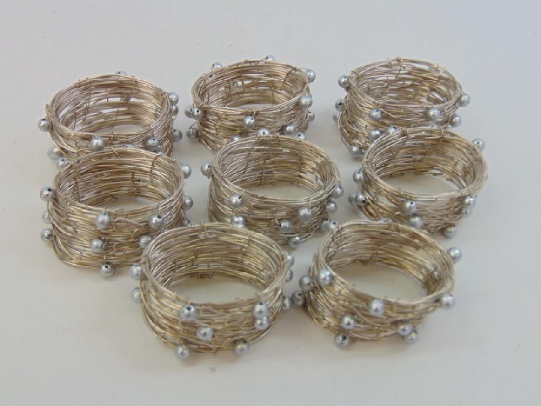 Set of 8 Contemporary Wire Wrap Napkin Rings: Set of 8 Contemporary Wire Wrap Napkin Rings. From a designer decorated back country Greenwich, Connecticut estate property.