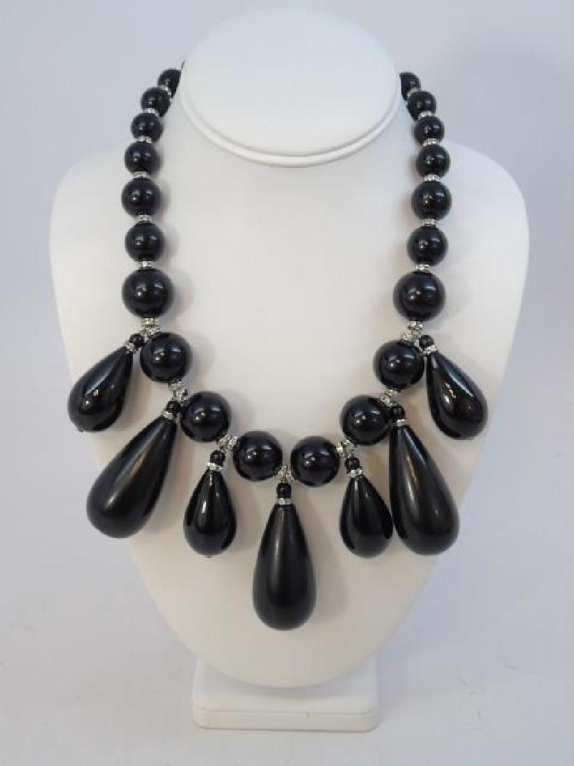 Giorgio Armani Black Glass Necklace with Paste: Giorgio Armani Black Glass Necklace with Paste. Giorgio Armani Black glass beads spaced with paste rondelles the center hung with a fringe of small and large matte jet pear shape drops capped with ron