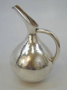 Vintage Ilias Lalaounis .900 Silver Pitcher: Ilias Lalaounis .900 Silver Pitcher. Art Deco form from antiquity handmade with bulbous hammered body with exaggerated spout and smooth curved handle. Fully signed "Lalaounis/900 & H.43." Weighs 11.9