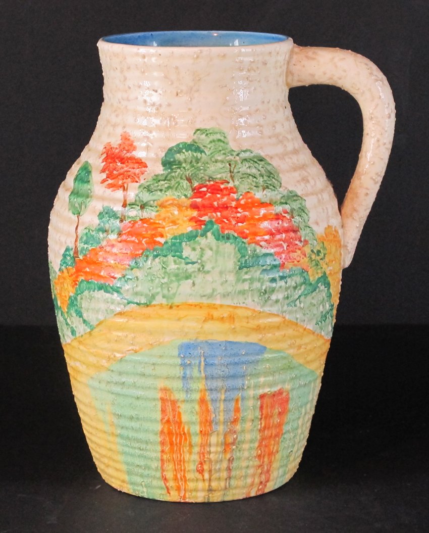 Clarice Clif Bizarre Ware Lotus Jug: Changing seasons trees marked Patina. Art deco pottery made in England Height: 11.50 Width: 8.00 Depth: 8.00