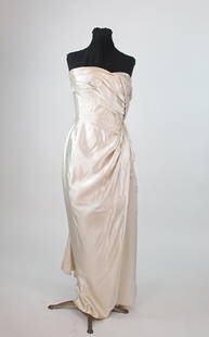 Maggy Rouff Ivory Slipper Satin Strapless Evening Gown: Heavy silk slipper satin strapless evening gown with side drape and silver bead work at the side panel approx size 2-4