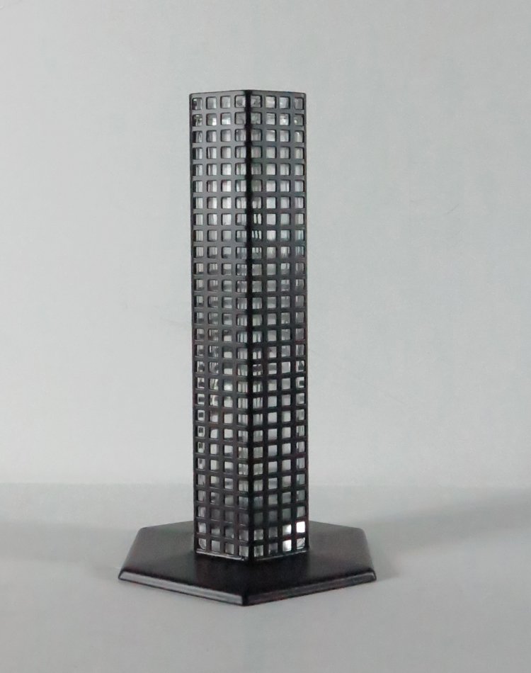 J. Hoffman Table Vase: J.Hoffman designed by Bleffaplast, hexagonal dark metal with geometrical pierced design, glass slip in vase 9xx