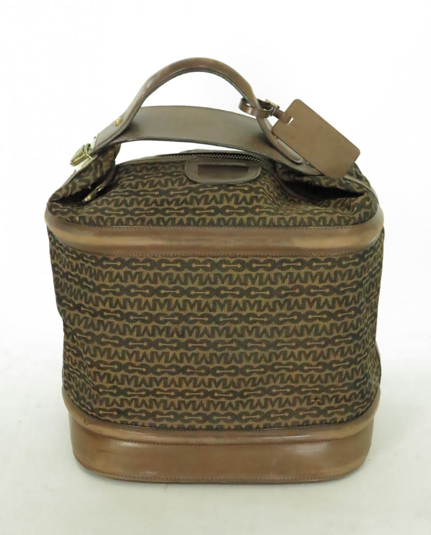 Vintage Mark Cross carry on bag: Leather trimmed carry on bag with logo canvas original keys locks work approx 16" high 9" deep 15" wide leather is in good condition brass feet on the bottom (4)