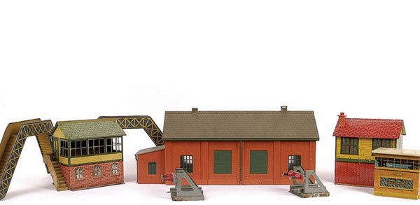 Hornby O Gauge Railway Accessories: Hornby O Gauge Railway accessories consisting of M Series Footbridge x 2, Pre-war No.1 Signal Box, Post-war Signal Box, No.1 buffer stops x 2, M Series Level Crossing, 6 x Bing, Bassett-Lowke and othe