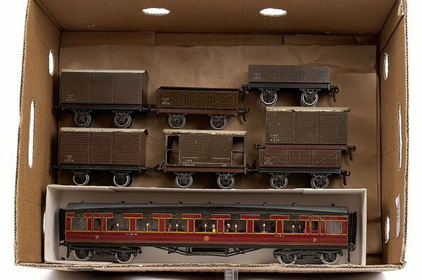 Bassett-Lowke Post-war LMS 4 wheel Goods Wagons: Bassett-Lowke O Gauge Post-war LMS 4 wheel Goods Wagons consisting of Luggage Vans x 3, Open Wagons x 3 and a Brake Van. Condition varies from Good to Excellent. The lot also includes a Scratch/Kitbui