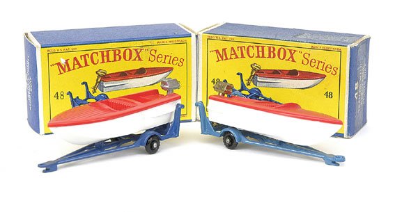 No.48 Sports Boat on Trailer - a pair: No.48 Sports Boat on Trailer - a pair (1) red, white, gold engine, light blue trailer with black plastic wheels and (2) same as (1) but silver engine with dark blue trailer - both are Mint in Near Min