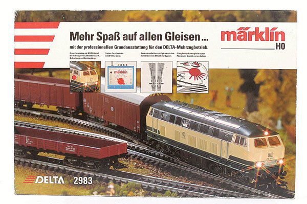 Marklin Delta 2983 Train Set: HO Marklin Delta 2983 Train Set comprising Bo-Bo DB blue and cream livery Class 216 Diesel Loco No.216 188-3, 4 x brown Freight vehicles (Bogie Covered Van, 4-wheel Covered Van, Bogie Highsided, Bogie