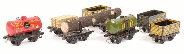 Trix Twin Unboxed Pre-war Wagons: Trix Twin a group of unboxed pre-war Wagons comprising 2 x yellow Trix Open, Bassett-Lowke Limited Open, red Shell Oil Tanker, green UD Tanker, pair of Bolster Wagons with log load, Flat Wagon with ti
