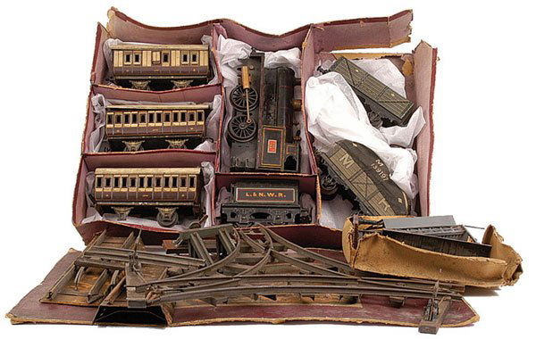 Bing Gauge 1 Live Steam Set: Bing Gauge 1 Live Steam Set consisting of 0-4-0 Loco and Tender LNWR black No.1132, Live Steam. Loco finished in black overall and lined in red, white and yellow. Indent to the boiler on one side, som