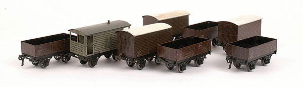 Bassett-Lowke Post-war 4-wheel Rolling Stock: Bassett-Lowke O Gauge Post-war 4-wheel Rolling Stock consisting of LMS Open Wagons x 4, LMS Luggage Vans x 3 and a BR Brake Van. Condition varies throughout generally Good to Good Plus. (8)