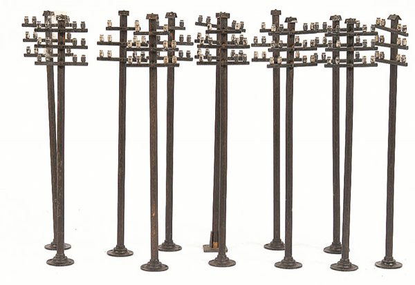 Bassett-Lowke O Gauge 3 Arm Telegraph Poles x 12: Bassett-Lowke O Gauge 3 arm Telegraph Poles x 12. One base replaced but otherwise Good to Good Plus, extremely difficult items to find. (12)