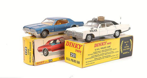 Dinky - a pair of American Cars.: Dinky - a pair of American Cars (1) No.251 USA Police Car - white Pontiac Parisienne, black roof, with protective cardboard ring, (2) No.174 Ford Mercury Cougar - blue, yellow interior, some silver su