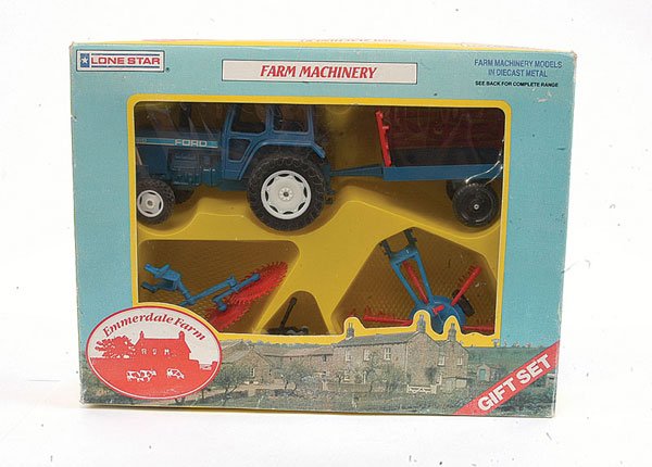 Lonestar Emmerdale Farm Machinery Gift Set: Lonestar Emmerdale Farm Machinery Gift Set - scarce set comprises Ford No.7610 Tractor and 2-wheeled Trailer and 3 x other implements - all are dark blue with red plastic fittings - Near Mint to Mint