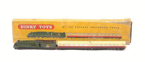 Dinky - No.798 Express Passenger Train Set: Dinky - No.798 Express Passenger Train Set. Comprising British Railways Loco in green with cream ridged hubs, 2 x deep red, cream, black Coaches - contents are Good Plus in a Fair card box with insert