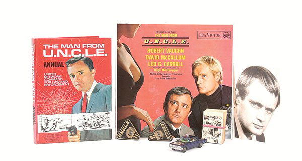 The Man from Uncle - A Small Mixed Lot: The Man from Uncle interesting lot containing hard back Annuals, original LP, Badges No.2 & 11, A & BC Collectors Cards, black and white still photo of David McCallum and Corgi Thrushbuster - blue, ca