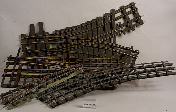 A Quantity of Bassett-Lowke and similar Track: Bassett-Lowke and similar wooden sleepered all steel, steel and brass and all brass 2 & 3 Rail track consisting of points x 21, curves x 60+, double curves x 6, straights x 20, double crossovers x 4,