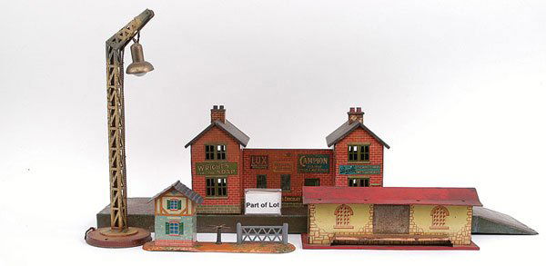 Bing and Other O Gauge Railway Accessories: Bing and other O Gauge Railway Accessories including a Station mounted on a base measuring 26" x 6" approx with two double storey buildings and central walkway canopy area. A number of advertising sig