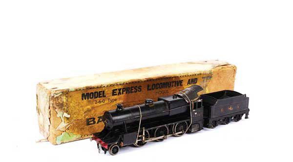 Bassett-Lowke 2-6-0 BR Black "Mogul" No.42980: Bassett-Lowke O Gauge 2-6-0 Loco and Tender BR black "Mogul" No.42980, Live Steam. Overall condition is Good contained in the remains of original box, box Poor.