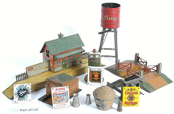 Bing/Fisher/Hornby O Gauge Railway Accessories: Bing/Fisher/Hornby O Gauge Railway Accessories consisting of Railway Station measuring 15" x 3 1/2" approx with single storey lithographed building with a number of advertising signs included in the p