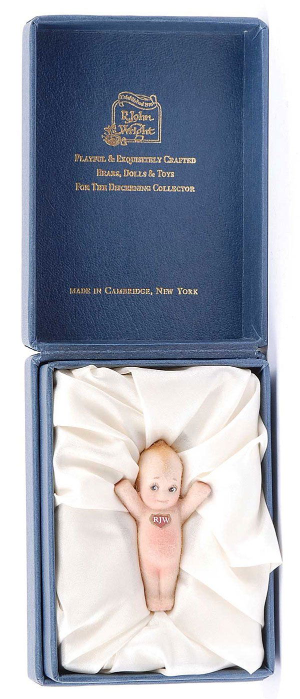 R. John Wright - Kewpie Boutonniere: R. John Wright - Kewpie Boutonniere, 2001, LE 172/1000, felt pin Kewpie Doll with numbered sticker to rear, certificate and registration card, in presentation case, Mint, 2.25"/5.5cm.