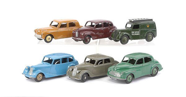 Dinky - A Group of Assorted 1950s Cars: Dinky assorted 1950s Cars (1) Hillman Minx - tan, cream ridged hubs, (2) Morris Oxford - mid green, (3) Triumph 1800 - mid blue, fawn ridged hubs, (4) Riley - dark grey, (5) Austin Devon - maroon and