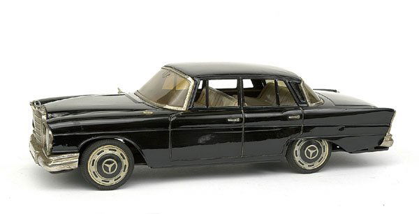 Mercedes 220SE by Nomura of Japan: Large scale friction drive Mercedes 220SE by Nomura of Japan - black, 37cm in length - detailed tin printed interior and hub caps, plated parts, lacks wing mirror and boot motif - otherwise Good Plus