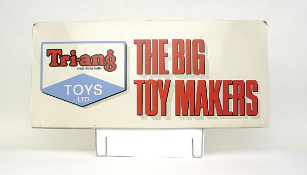 Sale Shop Display Sign "Triang Toys": A Point of Sale Shop Display Sign "Triang Toys the Big Toy Makers" - red, white and blue "Triang Toys Limited" logo, red printing on cream tinplate background with wire framing, small scuffs to 1 side