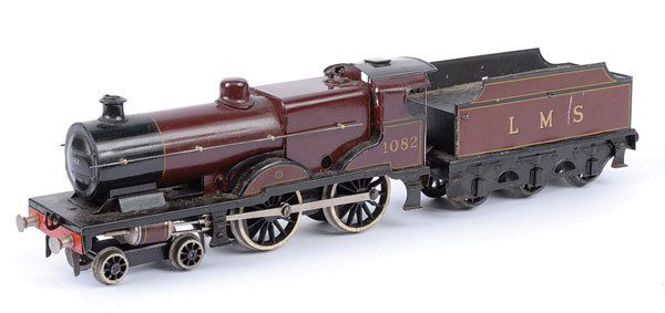 Bassett-Lowke 4-4-0 "COMPOUND" No.1082: Bassett-Lowke O Gauge 4-4-0 Loco and Tender LMS maroon "COMPOUND" No.1082, Clockwork. Version with Fowler Tender. Overall condition is Good.