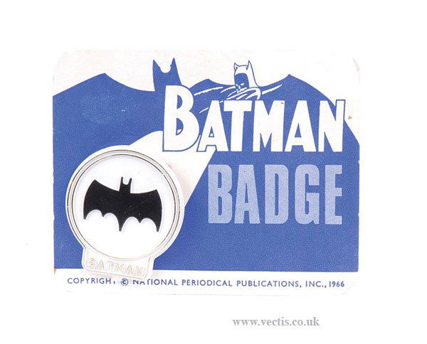 National Periodical Publications Batman Badge: National Periodical Publications Batman Badge, 1966, white plastic pin badge with Batman emblem in black, gold outer rings with BATMAN lettering to base, upon original blue and white printed card, Min