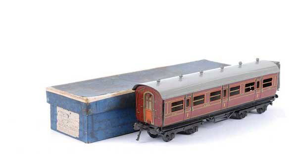 Bing/Bassett-Lowke LMS All 1st Coach No.2784: Bing for Bassett-Lowke O Gauge 1921 Series LMS all 1st Coach running number 2784. Sides are generally Excellent Plus, roof expertly repainted. Contained in a Fair Bassett-Lowke box.