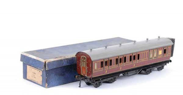 Bing/Bassett-Lowke LMS All 3rd Brake Coach: Bing for Bassett-Lowke O Gauge 1921 Series LMS all 3rd Brake Coach. Sides are generally Excellent Plus to Near Mint, roof is expertly repainted. Contained in a Fair Bassett-Lowke box.