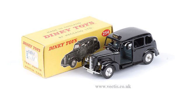 Dinky No.254 Austin Taxi: Dinky No.254 Austin Taxi - scarce colour variation is black, with spun hubs, grey diecast baseplate and driver - Near Mint to Mint in a Near Mint pale yellow box (price label still attached to one end