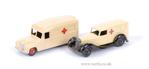 Dinky - A Pair of Ambulances: Dinky a pair of Ambulances (1) No.30H/253 Daimler Ambulance - cream, including red ridged hubs, very slight retouching to rear, (2) No.30F post-war Ambulance - cream, with filled in rear windows, blac
