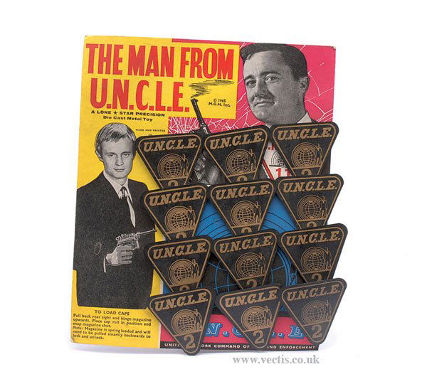 Lone Star Man from Uncle-Uncle No.2 Badges: Lone Star "The Man from Uncle" - plastic - "Uncle No.2" Badges, colourful trade card containing 12 examples - overall condition is generally Near Mint to Mint on Good Plus to Excellent colourful backi