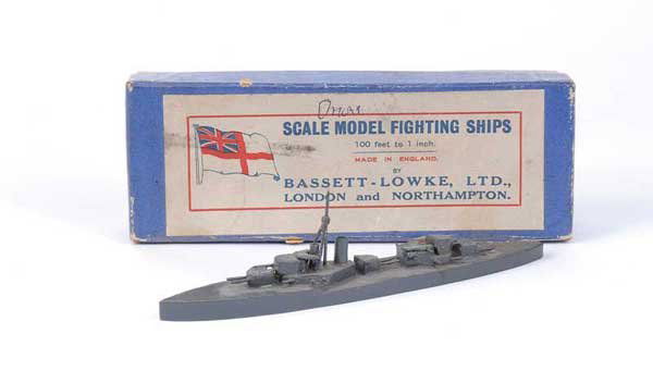 Bassett-Lowke "HMS Orion": Bassett-Lowke wooden Waterline Ship HMS Orion in battleship grey. A little dusty and lacks one funnel, hence Excellent Plus in original all blue box with white label and remains of original wrapping p