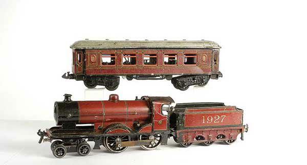 Bassett-Lowke 4-4-0 "Duke of York" No.1927: Bassett-Lowke O Gauge 4-4-0 Loco and Tender "Duke of York" LMS maroon No.1927, clockwork. Fair to Good. Also included with this lot is a Bing LMS 8-wheel Saloon Coach version with hinged roof showing