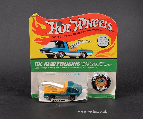 Hot Wheels Redliners Heavy Weights Tow Truck: Hot Wheels Redliners Heavy Weights Tow Truck finished in green, yellow, white jib - Mint on Good Plus to Excellent blister card - displays well.