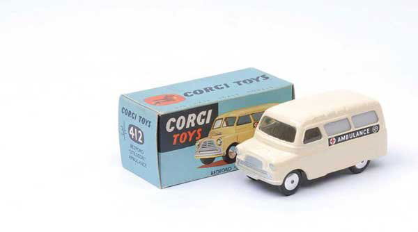Corgi No.412 Bedford "Ambulance": Corgi No.412 Bedford "Ambulance" - harder issue to find with cream body, flat spun hubs, without split screen, ribbed roof - Near Mint nice example in Excellent all carded blue box.