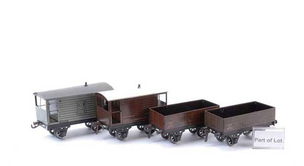 Bassett-Lowke Post-war 4-wheel Rolling Stock: Bassett-Lowke O Gauge post-war 4-wheel Rolling Stock consisting of LMS Covered Van x 4, LMS Open Wagon x 3, LMS Brake Van and a BR Brake Van. Condition varies Good Plus to Excellent. (9)