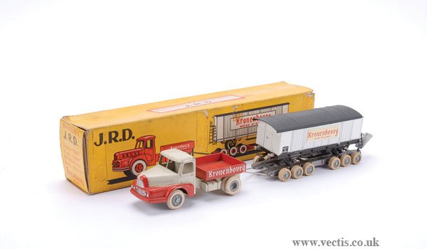 JRD No.125 Tractor Unit with Low Loader Trailer: JRD No.125 Tractor Unit with Low Loader Trailer and Train Goods Wagon load "Kronenbourg" - overall condition is generally Good to Good Plus (tyres have hardened) in Fair box.