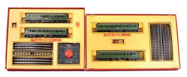 Triang - A Pair of DMU 2-car Train Sets: Triang a pair of DMU 2-car Train sets (1) R2M containing power and dummy Class 101 Trailer Cars along with oval of Series 3 track, battery controller OO/HO Triang plastic badge and empty oil tube, con