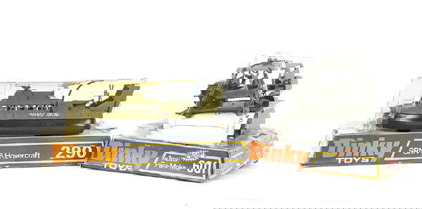 Dinky No.290 Hovercraft & No.601 Austin Paramoke: A pair - (1) No.290 SRN Hovercraft in military livery - green, black, white - Near Mint in Poor bubble pack, (2) No.601 Austin Paramoke - military green, light grey roof, with green platform and parac