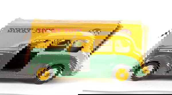 Dinky No.254 Austin Taxi: No.254 Austin Taxi - two tone, green lower, yellow upper and ridged hubs, black base and interior, a couple of small chips particularly near one front wing and rear boot - otherwise Excellent Plus bri