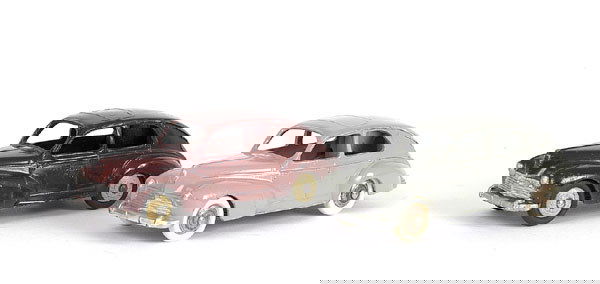 Dinky 2 x 24R Peugeot 203: 2 x 24R Peugeot 203 - (1) early issue with small rear window and rear filler cap - maroon, cream ridged wheels (paint chips touched in and wheels fatigued) - Good, (2) later issue with large rear wind