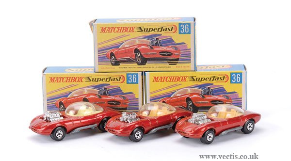 Matchbox Superfast No.36 Draguar x 3: Matchbox Superfast No.36 Draguar - a group of 3, (1) metallic red, cream interior, chrome engine, "Draguar" rear label, (2) same as (1) but without rear label and (3) same as (2) but pale yellow inter