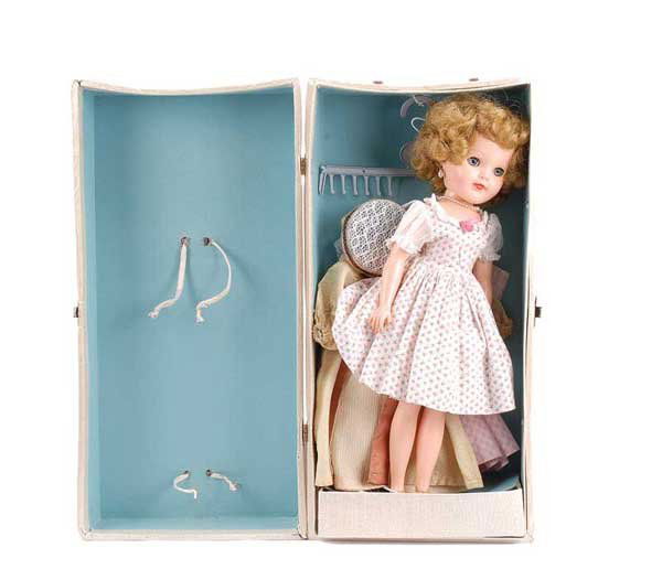 Effanbee Vinyl Teenage Doll with Wardrobe: Effanbee vinyl Teenage Doll with wardrobe, American, 1950s, weighted blue eyes, blond Saran hair, pierced ears with pear drop ear-rings and matching necklace, wearing pink and white rosebud pattern dr