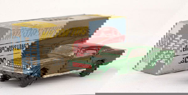 Milton Toys (India) No.329 Ford Mustang: Milton Toys (India) No.329 Ford Mustang - metallic green, white interior, black plastic wheels - Near Mint in Good Plus but grubby all card box.