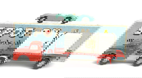 Spot-On No.106A Austin Prime Mover: No.106A Austin Prime Mover "The British Motor Corporation Ltd" - orangey red cab and back, grey chassis - Excellent Plus (apart from slight wear to one side decal) complete with MGA Sports Car in crat